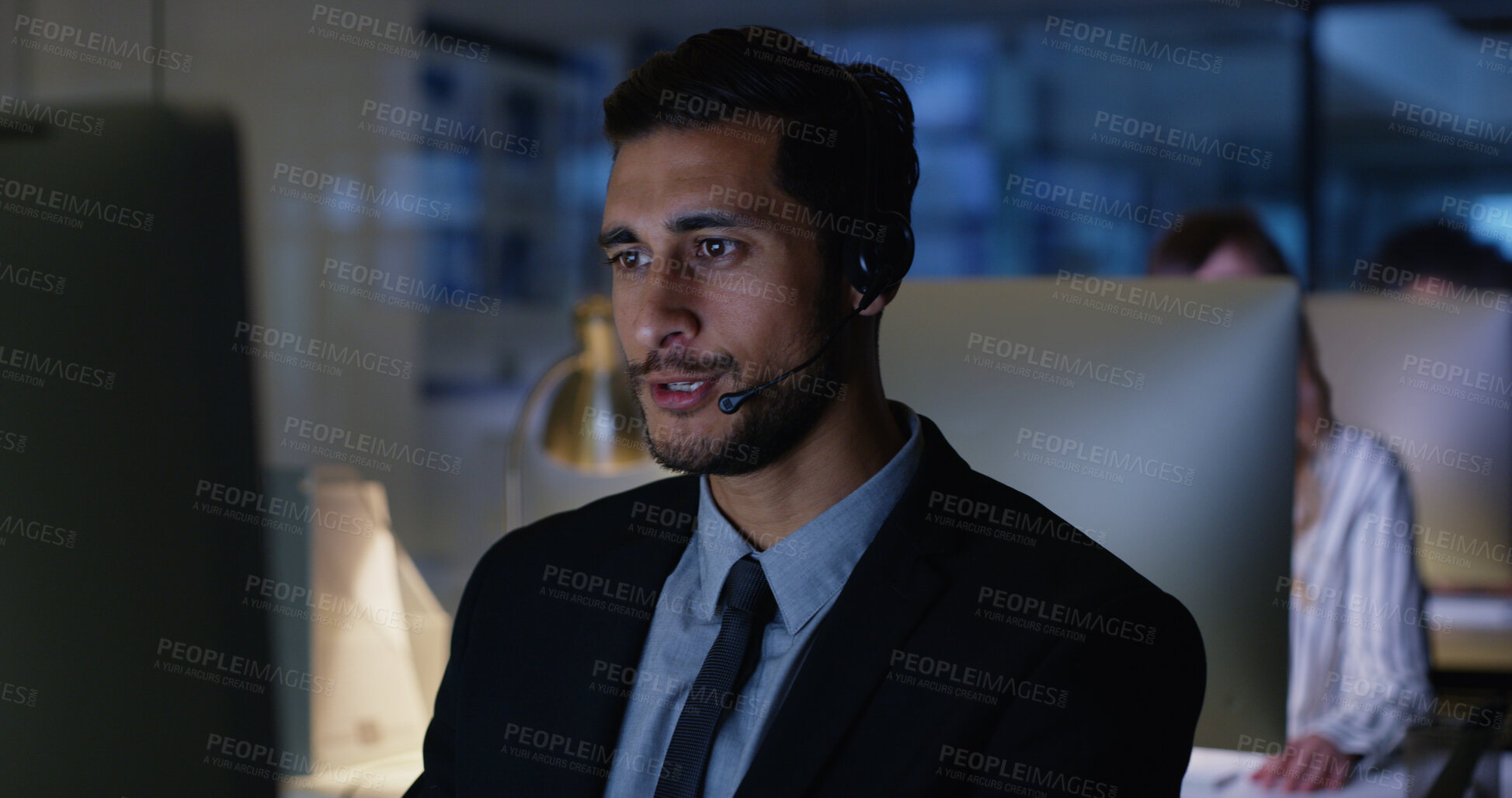 Buy stock photo Night, advisor or businessman in call center with computer, communication or sales at help desk. Virtual assistant, consultant or customer service agent with mic headset, online support or advice