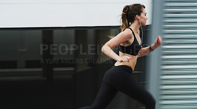 Buy stock photo Running, exercise and woman on street, outdoor and practice for marathon in morning, speed and fitness. Healthy, runner and person with earphones on road, athlete and training with energy for sports