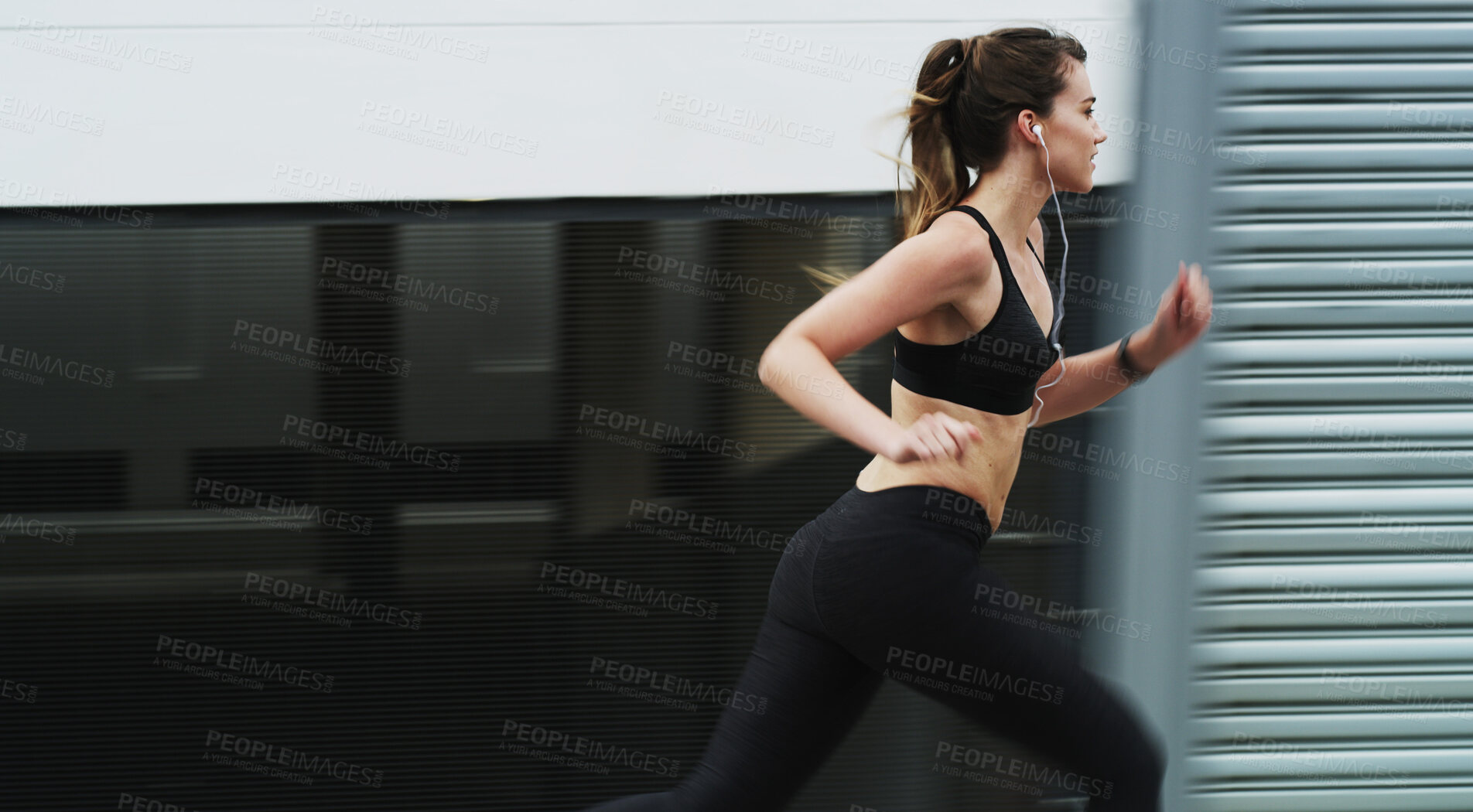Buy stock photo Running, exercise and woman on street, outdoor and practice for marathon in morning, speed and fitness. Healthy, runner and person with earphones on road, athlete and training with energy for sports