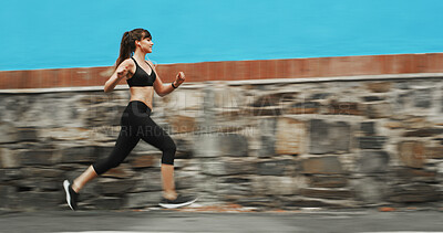 Buy stock photo Running, speed and woman with earphones, outdoor and practice for marathon in morning, exercise and blurred. Fitness, runner and person on road for sports, athlete and training with energy for cardio