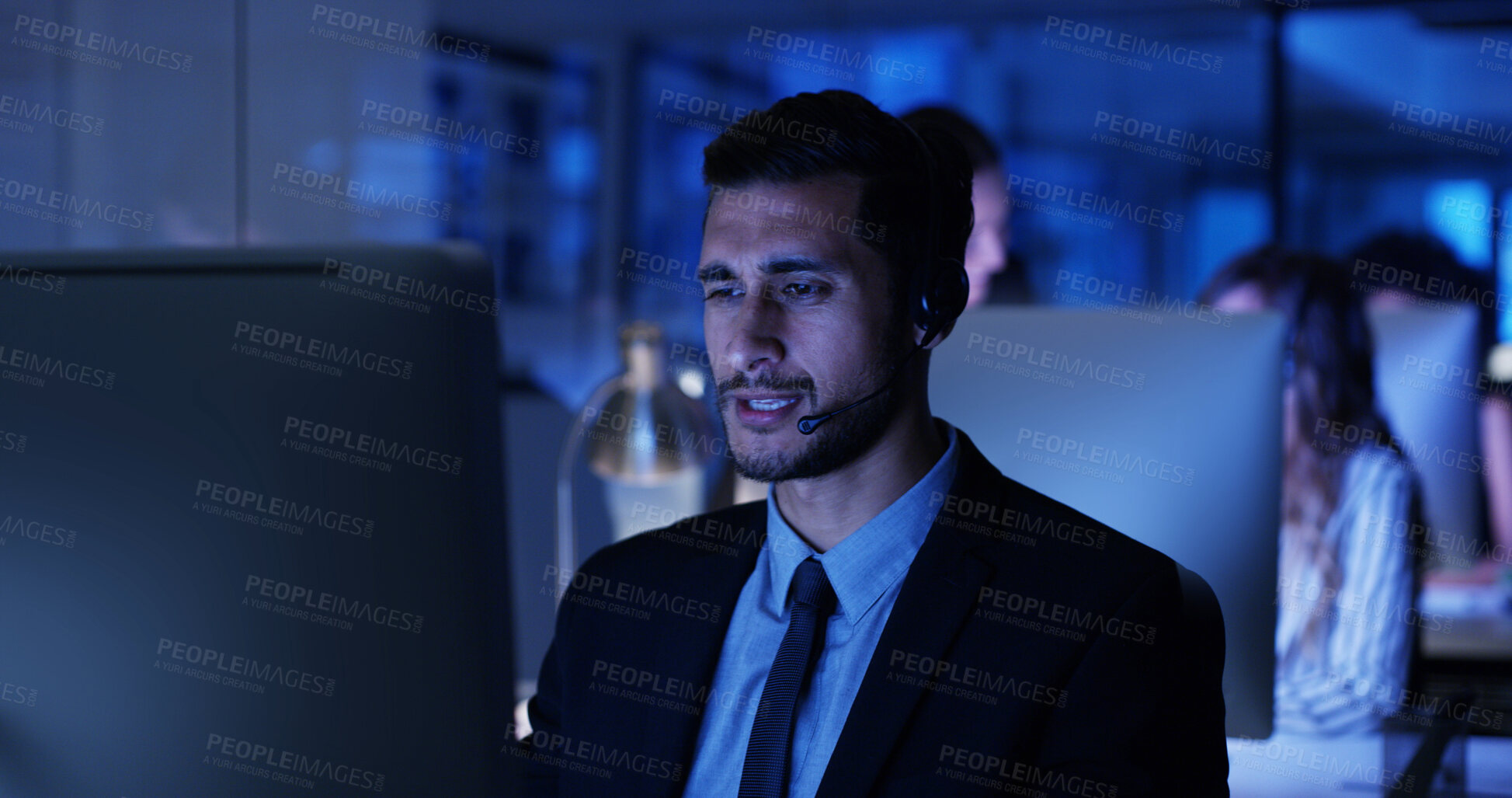 Buy stock photo Night, computer or businessman in call center with sales, communication or advice at help desk. Virtual assistant, consultant or customer service agent with mic headset, online support or feedback