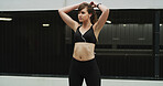 Woman, earphones and exercise in city, thinking and ready to start with fitness, training or challenge. Girl, runner and streaming subscription for listening to music, workout or outdoor in Argentina