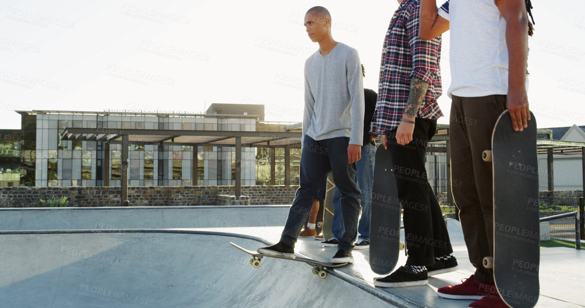 Buy stock photo Skateboard, friends and men in city for sport, competition challenge or start exercise by bowl with space. Outdoor, fitness group or skate park for action, performance or balance with hands for hobby