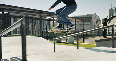 Buy stock photo Skateboard, legs and person jump in city for sport, competition challenge or adrenaline. Outdoor, energy and stunt with shoes at skate park for action, extreme performance and cool trick for hobby