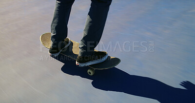 Buy stock photo Skateboard, feet and person training for trick for outdoor hobby, activity or challenge at park. Sports, shoes and legs of skater with sneakers for skating with skills learning for competition.