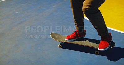 Buy stock photo Skateboard, outdoor and person learning trick for hobby, activity or challenge at park. Feet, gen z and legs of skater with sneakers for skating training with skills for competition in city.