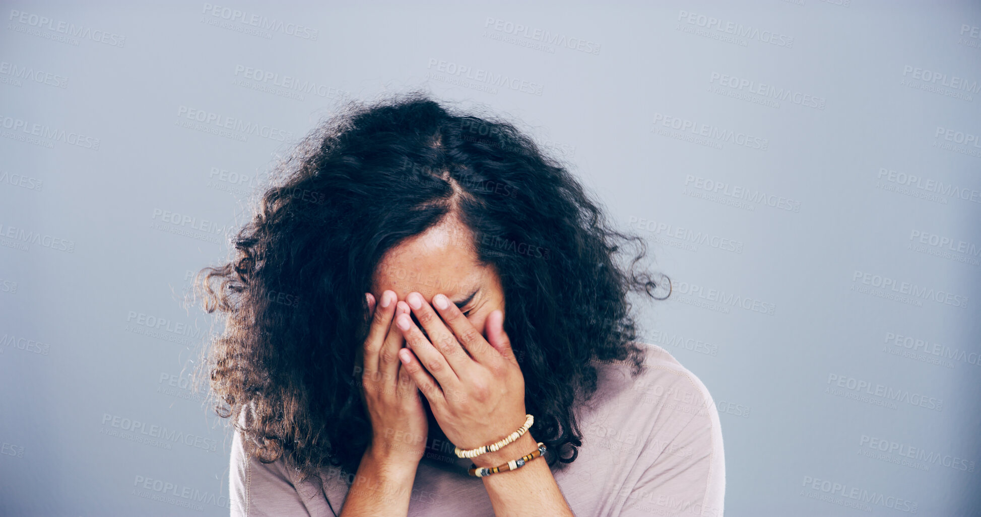 Buy stock photo Crying, grief and woman in studio, depression and emotional reaction on blue background. Person, model and girl with mockup space, stress and breakup with loss, mourning and broken heart with tears