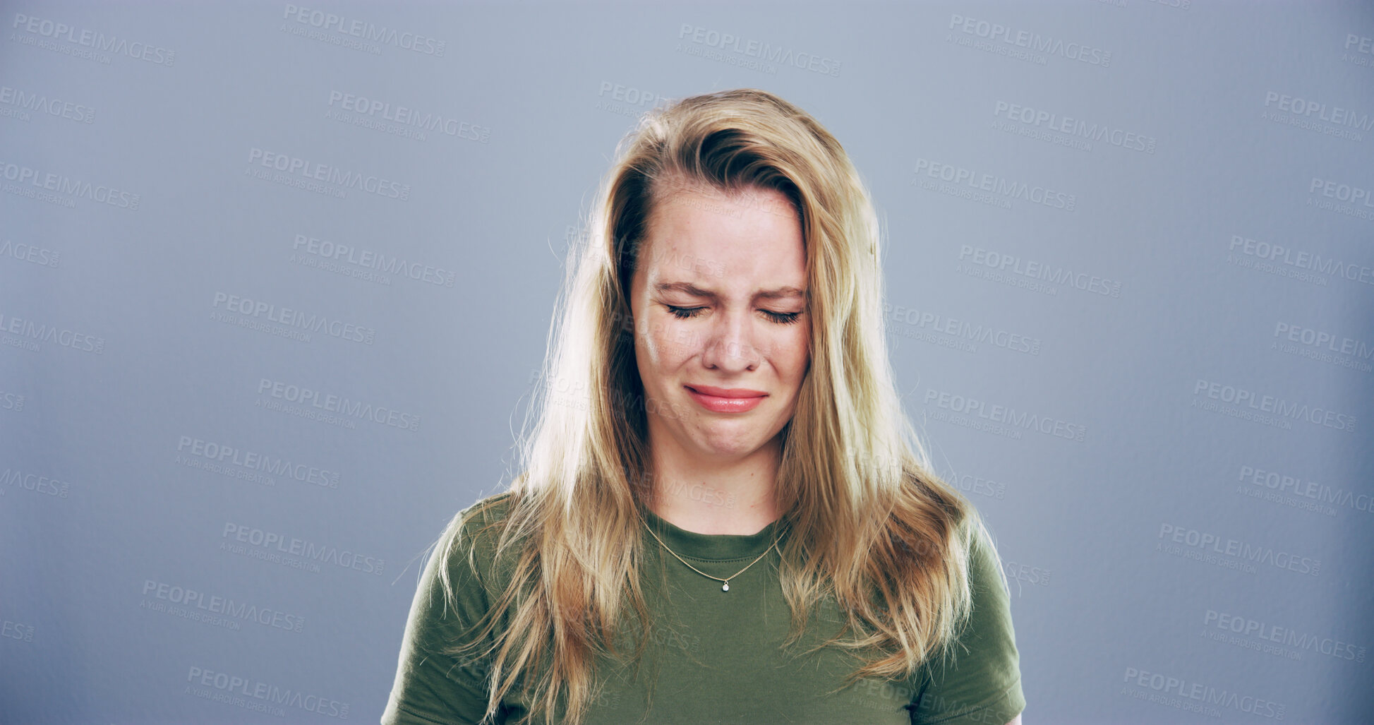 Buy stock photo Woman, sad and crying with sorrow in studio for mourning loss, broken heart and bad news. Person, mockup space and grief with depression, mental health and ptsd for trauma memory on gray background