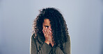 Crying, sad and woman in studio, sorrow and emotional reaction on blue background. Person, model and depression with stress, sad and grief with loss, mourning and broken heart with breakup or trauma