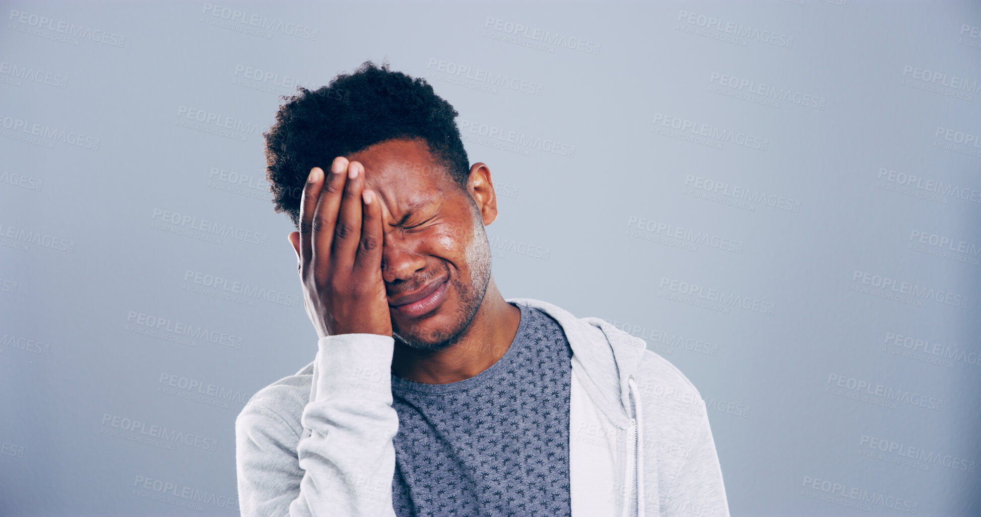 Buy stock photo Sad, black man or mistake with stress in studio for mental breakdown, anxiety or pain on a gray background. Male person, emotion or eye strain with headache for pressure or depression on mockup space