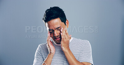 Buy stock photo Sad man, mistake or depression with stress in studio for mental breakdown or anxiety on a gray background. Male person, emotion or sulk eyes with headache, tears or expression for loneliness on space