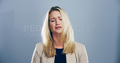 Buy stock photo Sad, woman and tears for crying in studio for mourning loss, broken heart and bad news. Person, mockup space and grief pain with depression, mental health and ptsd of trauma memory on gray background
