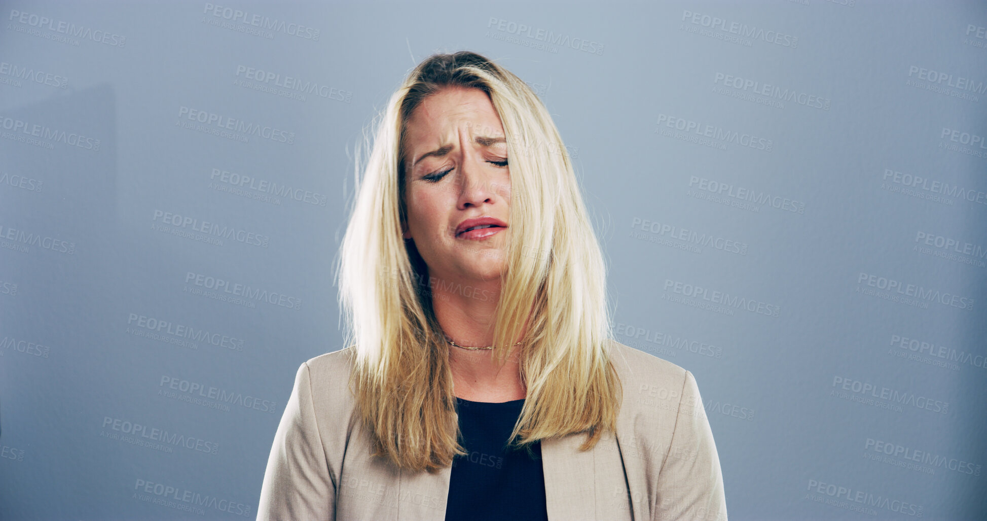 Buy stock photo Sad, woman and tears for crying in studio for mourning loss, broken heart and bad news. Person, mockup space and grief pain with depression, mental health and ptsd of trauma memory on gray background