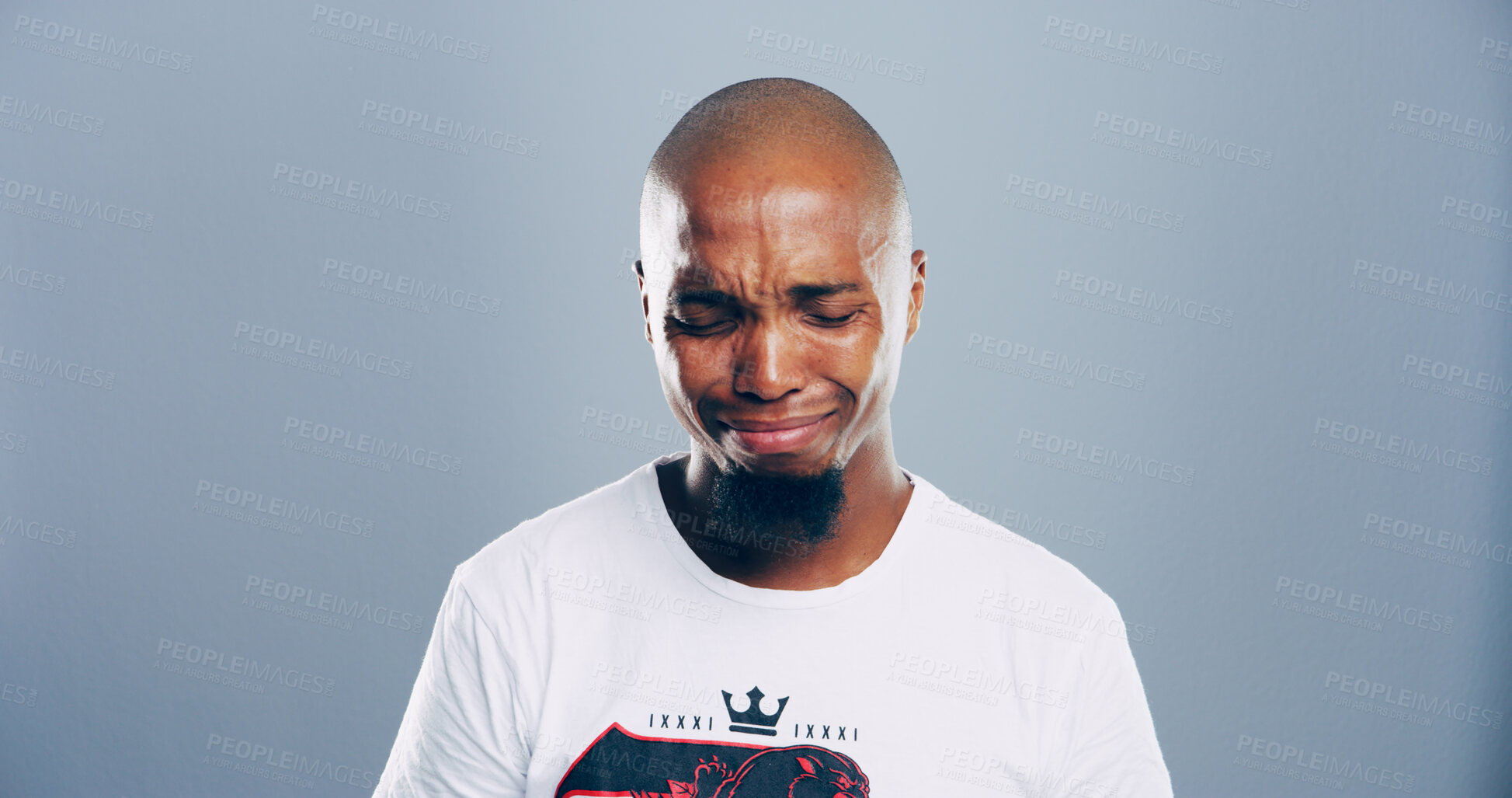 Buy stock photo Sad, black man and crying tears in studio for mourning loss, broken heart and bad news. Person, mockup space and grief of depression sorrow, mental health and ptsd of trauma memory on gray background
