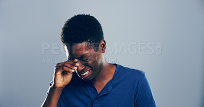 Buy stock photo Sad, black man and crying with mistake, breakup or pain in studio for mental breakdown on a gray background. Male person, expression or sulk eyes with tears for broken heart or loneliness on space