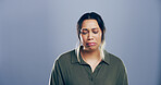 Depression, mental health and sadness with woman on gray background space for reaction to bad news. Crying, grief and loss with unhappy person on studio mockup for anxiety, breakup or psychology