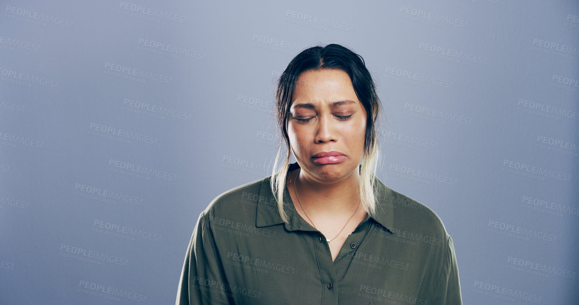 Buy stock photo Gray background, mental health or sadness and woman with depression for reaction to bad news. Crying, grief and loss with unhappy person on studio mockup for anxiety, breakup, pain or trauma