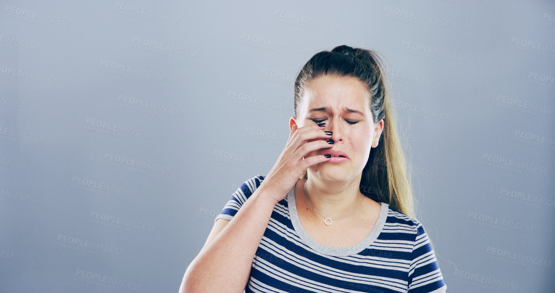 Buy stock photo Grief, woman and sad with crying in studio for broken heart, trauma and mourning loss. Mockup space, person and unhappy on gray background with grieving, mental health and emotional from bad news