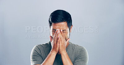 Buy stock photo Grief, Asian man and crying emotions in studio for mourning loss, broken heart and bad news. Sad, mockup space and person with depression, mental health and ptsd with trauma memory on gray background