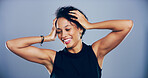 Dance, energy and smile of happy woman in studio for celebration, clubbing or party fun. Event, moving and music with excited dancer person on gray background mockup for beat, choreography or rhythm