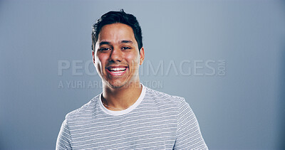 Buy stock photo Space, funny or portrait of Indian man in studio with confidence, mockup or humor. Comedian, comic performer or face of happy person laughing isolated on grey background with joke for creative career