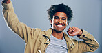 Dance, energy and portrait of happy man in studio for celebration, clubbing or party fun. Moving, music and smile of excited person at disco on gray background mockup for beat, choreography or rhythm
