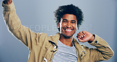 Buy stock photo Dance, energy and portrait of happy man in studio for celebration, clubbing or party fun. Moving, music and smile of excited person at disco on gray background for beat, choreography or rhythm