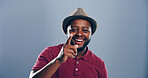 Black man, portrait and pointing at you for invitation, welcome or join us with smile on blue studio background. Choice, decision or opportunity with happiness for space, motivation and offer