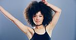 Dance, energy and portrait of woman in studio for celebration, clubbing or party fun. Afro, moving and music with confident dancer person on gray background mockup for beat, choreography or rhythm