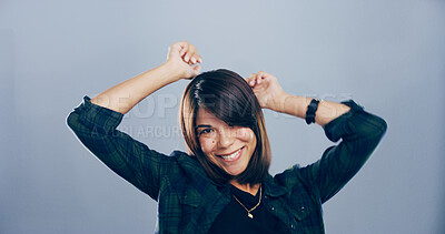 Buy stock photo Dance, portrait and smile of excited woman in studio for celebration, clubbing or party fun. Energy, moving and music with happy dancer person on gray background mockup for choreography or rhythm
