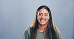Portrait, woman and happy with laugh in studio for confidence, joke and good mood on gray background. Comic, model and smile with carefree personality for comedy, humor or funny reaction to meme