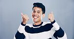 Dance, portrait and thumbs up with happy man in studio for celebration, clubbing or party fun. Music, smile and success with excited dancer person on gray background mockup for choreography or rhythm