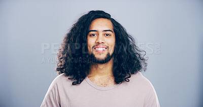 Buy stock photo Happy man, portrait or positive expression with cheerful emotion on a gray studio background. Face, male person or hipster model with smile for friendly attitude or self confidence on mockup space
