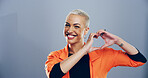 Happy, heart hands and portrait with woman in studio for affection, love or romance. Emoji, smile and and social media with flirty person on gray background mockup for health or wellness gesture
