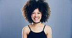 Happy woman, portrait and studio with afro for hairstyle, positive attitude or expression. Creative, female person or model with smile, friendly emotion or self confidence on a gray background
