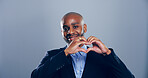 Happy black man, business and heart hands for love, care or support on gray background in studio. Portrait, African person and shape, emoji or romantic gesture for trust or thank you on mockup space