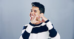 Love sign, heart hands and portrait of man for support with charity or health isolated on gray background. Mockup space, smile and emoji for care, romance or wellness with symbol or shape in studio