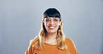 Glasses, creative and portrait of woman in studio with confidence, mockup space and gen z style. Artist, fashion designer and happy face of small business professional on gray background with smile