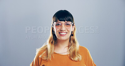 Buy stock photo Glasses, creative and portrait of woman in studio with confidence, mockup space and gen z style. Artist, fashion designer and happy face of small business professional on gray background with smile