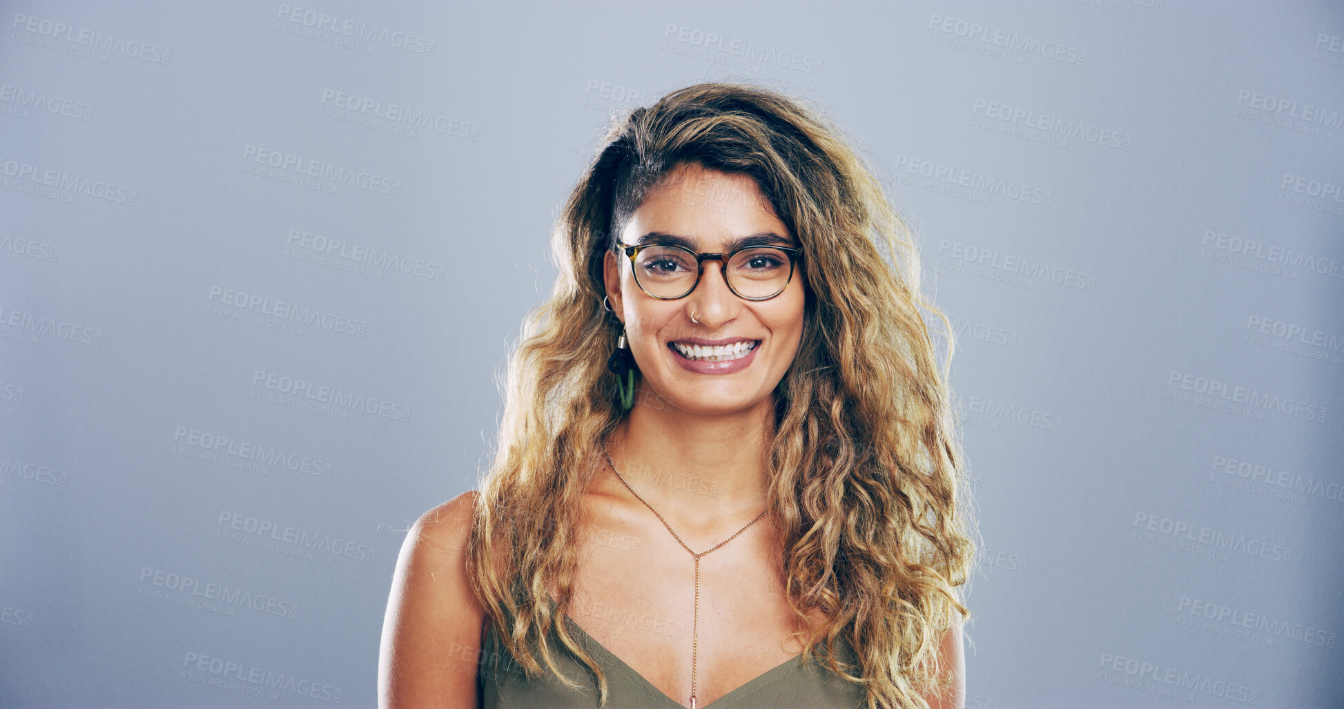 Buy stock photo Glasses, portrait and student with happy woman in studio for development, education or learning. College, smile and university with intelligent person on gray background mockup for knowledge or study