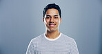 Smile, confidence and portrait of man in studio with mockup space, creative or university registration. Opportunity, identity card or gen z student in college candidate recruitment on gray background