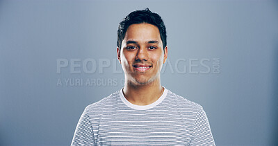 Buy stock photo Smile, confidence and portrait of man in studio with mockup space, creative or university registration. Opportunity, identity card or gen z student in college candidate recruitment on gray background