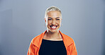 Happy woman, smile and studio portrait with creative employee, pride and confident for freelance career. Writer, freelancer or author with professional headshot by mockup space on blue background