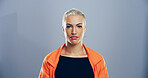 Woman, portrait and creative professional in studio, serious for career with pride and confidence. Business, about us and opportunity or growth for videographer isolated on blue background  by space