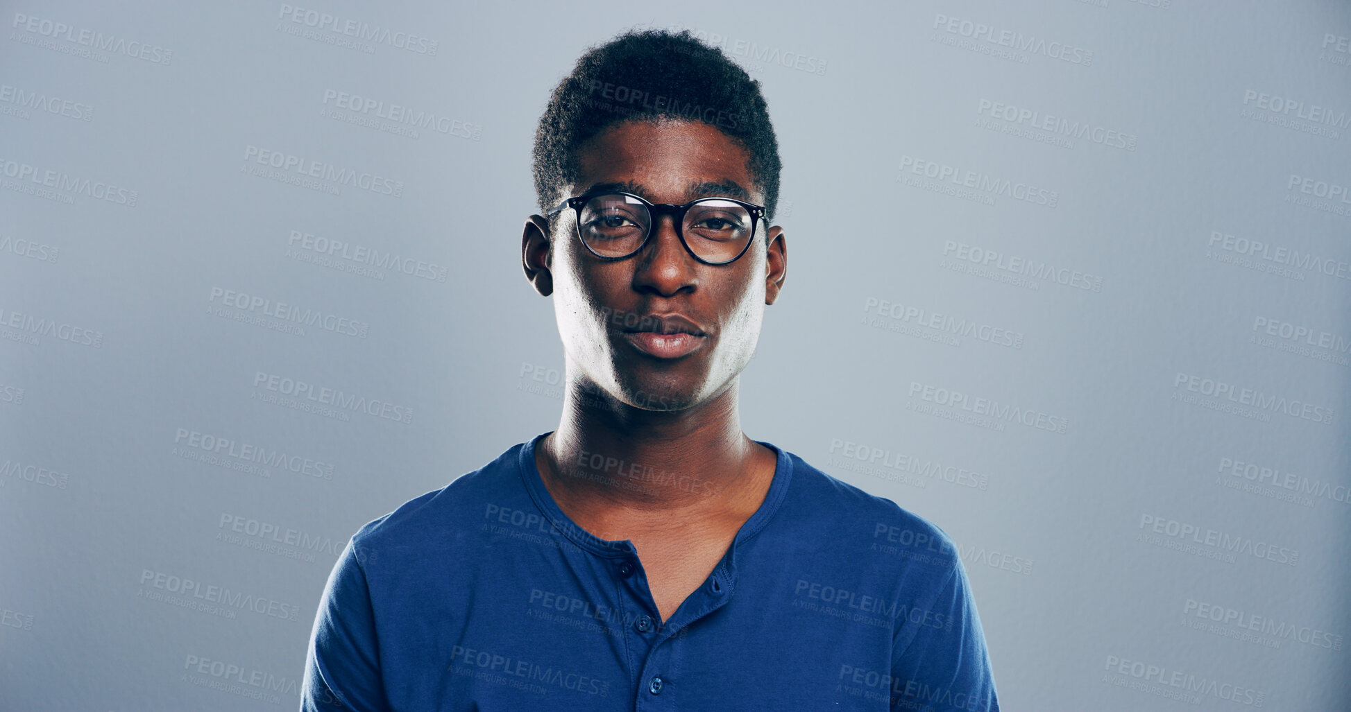 Buy stock photo Smart, student or portrait of black man in studio for skill development, college education or learning. Face, nerd and African person with glasses on grey background mockup for school scholarship