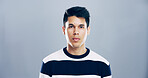 Portrait, space and confidence with man in studio for development, education or learning. College, scholarship and university with student person on gray background mockup for academic curriculum