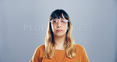 Buy stock photo Professional, editor and portrait of woman on gray background for freelance career, editing and journalism. Mockup space, glasses and isolated person for news agency, publisher and job in studio