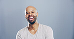 Portrait, laugh and business man in studio, comedy screenwriter and script author. Face, funny and happy African person, creative professional and excited with space isolated on gray background