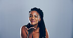 Portrait, black woman and blowing kiss with love for romance, affection or greeting on a gray studio background. Creative, female person or model with care, palm or flirt in distance on mockup space