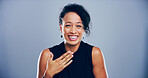 Face, woman and smile for laugh in studio with confidence, joke and good mood on gray background. Space, young model and happy with carefree personality for comedy, humor or funny reaction to meme
